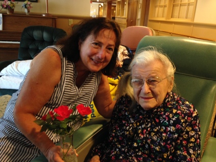Niece Jean brings knockout roses for Aunt Ruthie now living at Landis Homes.